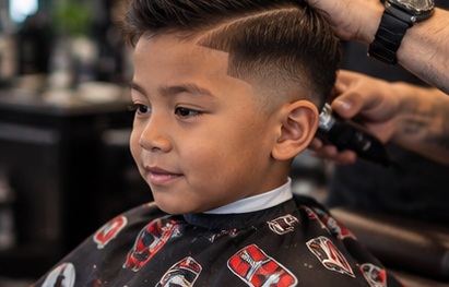 Kid's haircut in the barber chair